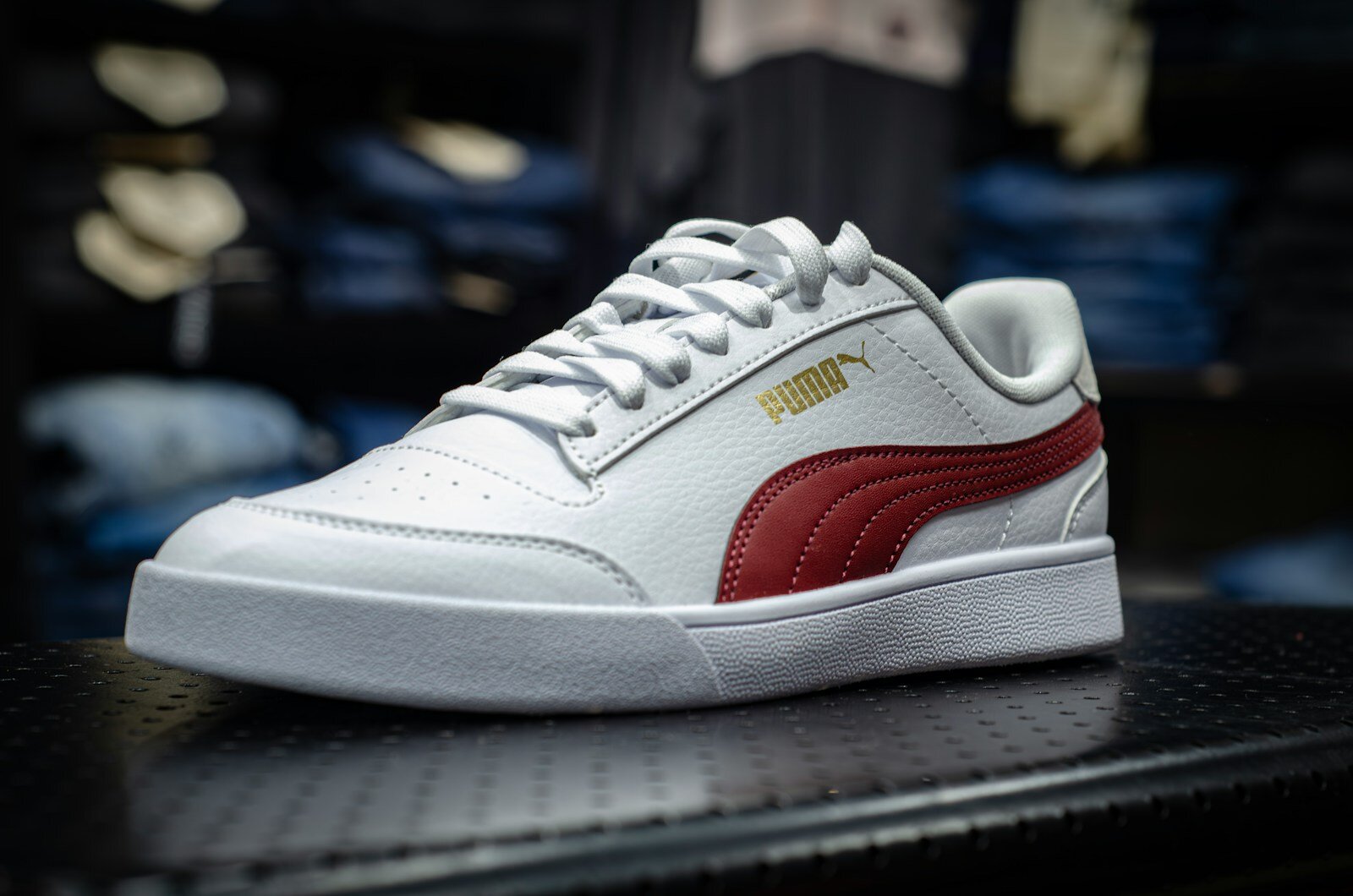 a white and red sneaker on a table