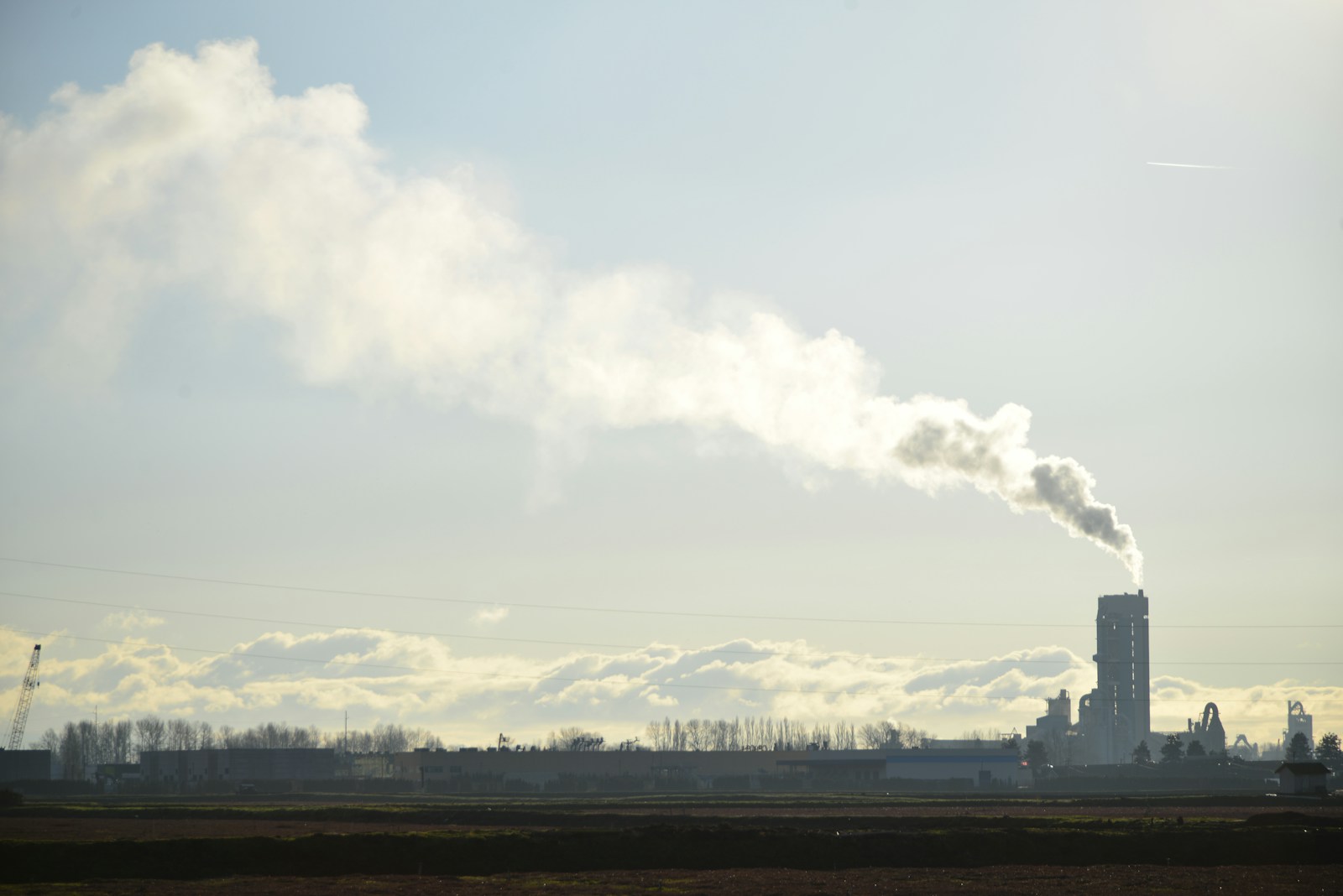 A factory with smoke coming out of it