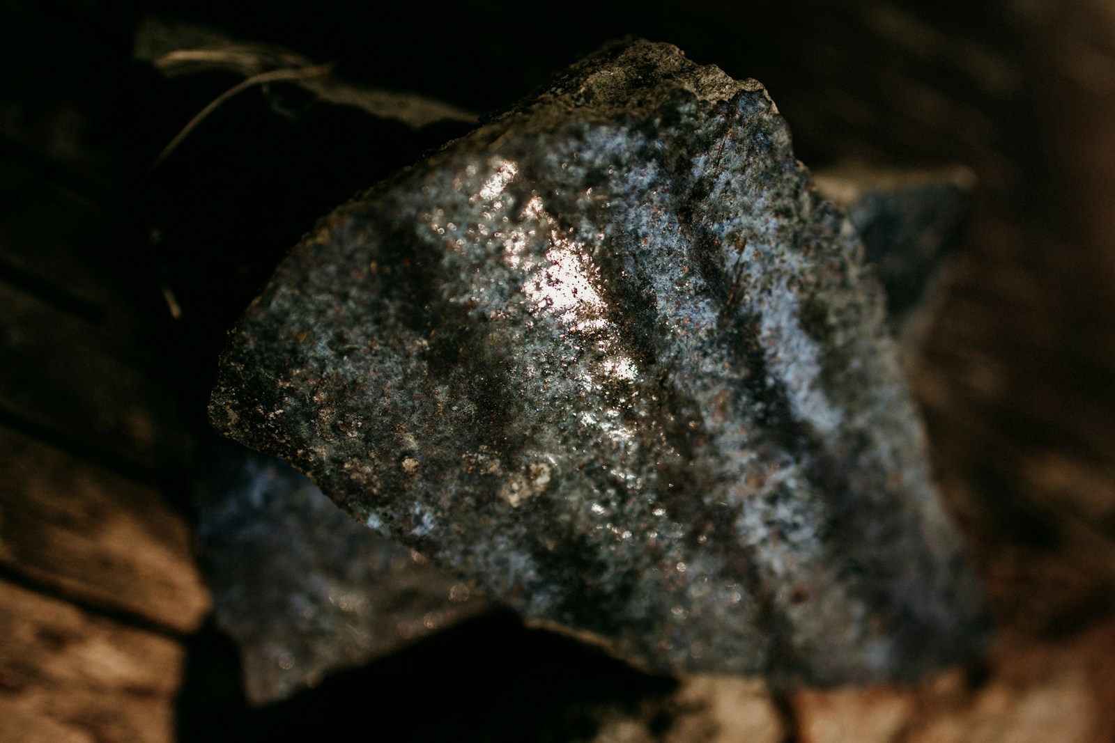 A close up of a metal object on a wooden surface