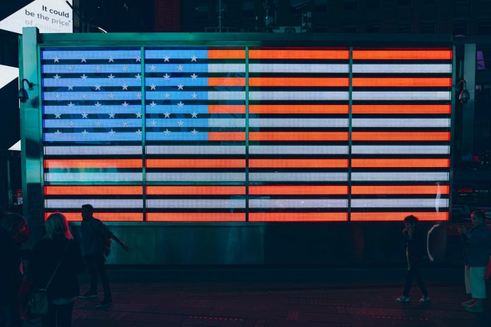 shallow focus photo of flag of United States of America neon light