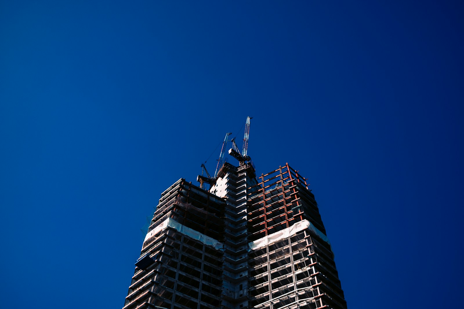 a very tall building with a sky background