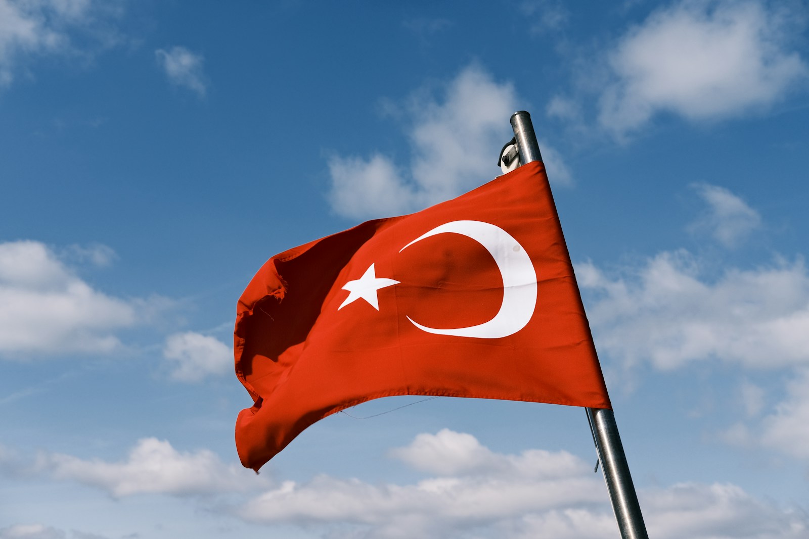 a red flag with a white star on it