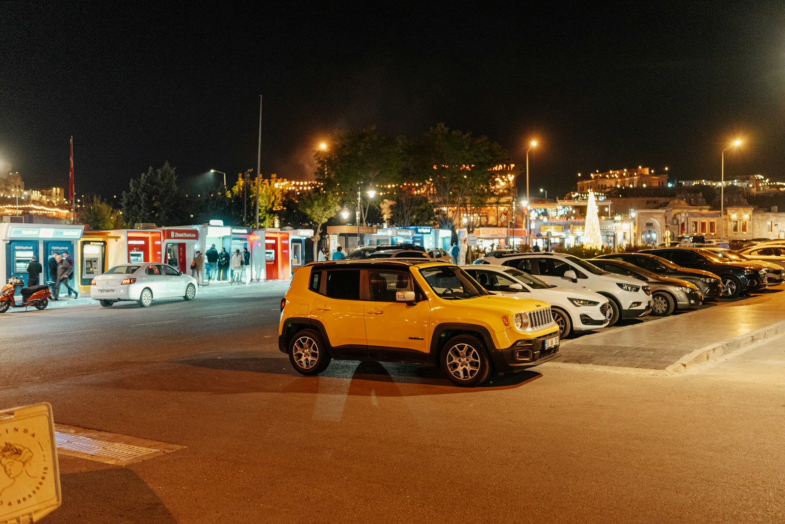 A parking lot filled with lots of parked cars