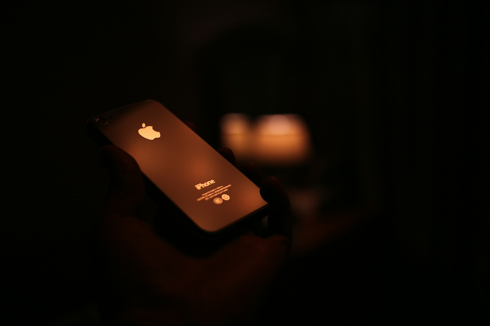 apple iphone on black surface