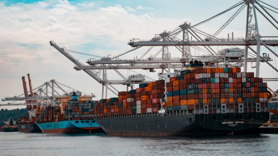 cargo ships docked at the pier during day