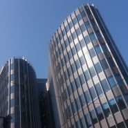 white and black concrete building under blue sky during daytime