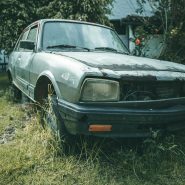 a car that is sitting in the grass