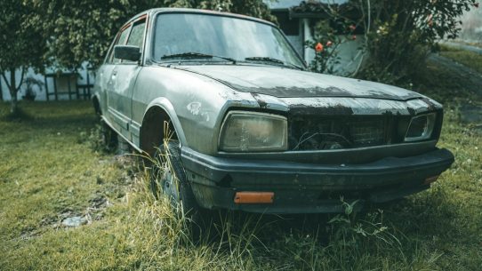 a car that is sitting in the grass