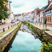 houses and body of water during daytime