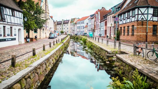 houses and body of water during daytime