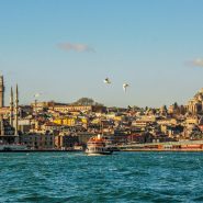 city buildings near body of water during daytime