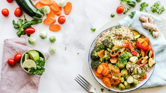 Colorful quinoa salad with fresh vegetables creates a healthy, balanced meal.