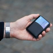 a person holding a cell phone in their hand