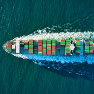 aerial view of blue and white boat on body of water during daytime