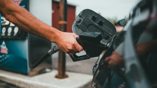 person holding black corded device