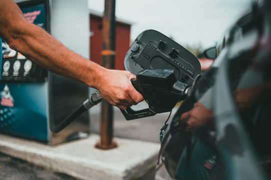 person holding black corded device