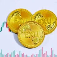 gold round coin on white surface