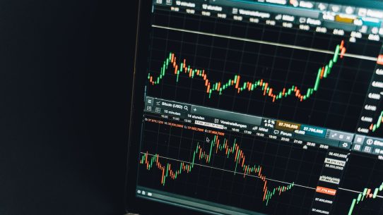 Close-up of a live cryptocurrency trading chart screen displaying dynamic market trends and analysis.