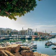 a harbor filled with lots of boats on top of a body of water