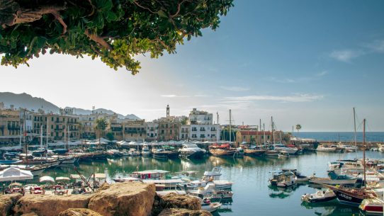 a harbor filled with lots of boats on top of a body of water