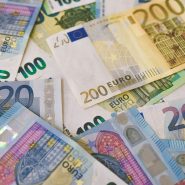 A scattered pile of various euro banknotes including twenty, one hundred, and two hundred denominations