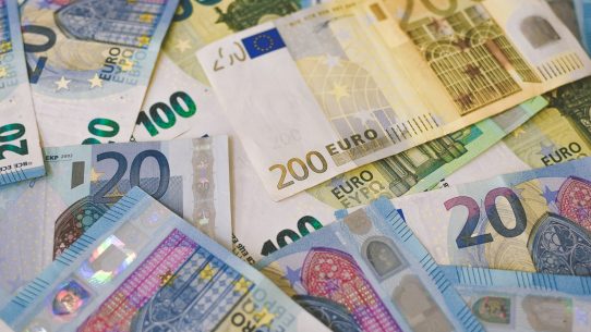 A scattered pile of various euro banknotes including twenty, one hundred, and two hundred denominations