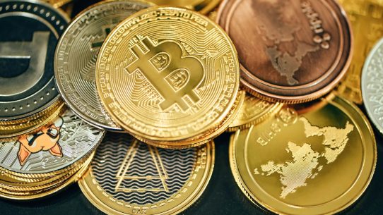 a pile of gold and silver bitcoins