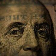A close-up of Benjamin Franklin on a United States one hundred dollar bill