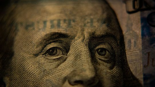 A close-up of Benjamin Franklin on a United States one hundred dollar bill