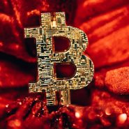 a golden bitcoin sitting on top of a red blanket